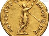 a close up of a gold coin with a man holding a sword