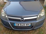 a picture of a car that is parked in the grass