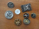 a lot of buttons that are sitting on a table