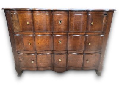 an image of a wooden chest of drawers with many drawers