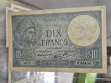 a picture of a french bank note in a glass case