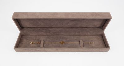 an open box with three rings inside of it