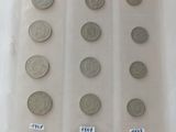 a lot of coins that are in a plastic container