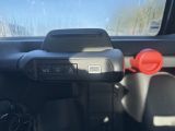 a close up of a car dashboard with a phone in it