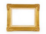 an old gold picture frame on a white wall with a white background