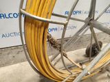 a yellow hose that is attached to a metal wheel