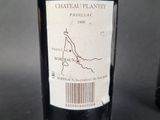 a bottle of wine that is sitting on a table
