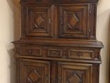 a large wooden cabinet in the corner of a room
