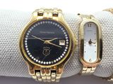 two watches on the wrist of a woman on a white cloth