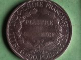 a close up of a coin on a green surface