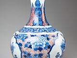 a blue and white vase sitting on a table