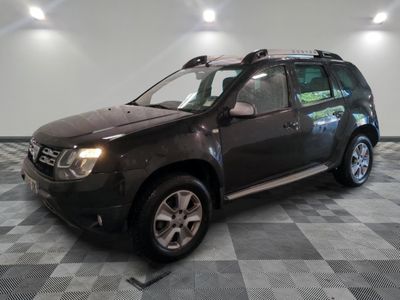 a picture of a dark colored suv parked in a garage