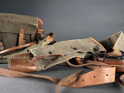 a bag and a pair of shoes sitting on a table