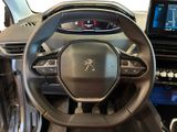 the interior of a car with a steering wheel and dashboard controls