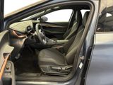 the interior of a car with the door open and the driver ' s seat down