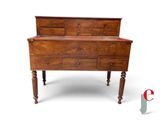 an old wooden dresser with drawers on it ' s legs