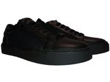 a picture of a black leather sneaker with a black sole