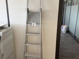 a ladder leaning against a wall in an office