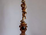 a tall lamp that is sitting on a table