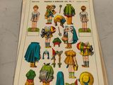 a picture of a book with a bunch of paper dolls on it