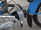 a close up of a motorcycle with a blue engine