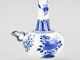 blue and white vase with flowers and birds on it