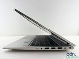 an open laptop computer sitting on top of a white table