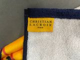 a towel with a label on it that says christian lacroix