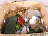 a box full of assorted items sitting on a table