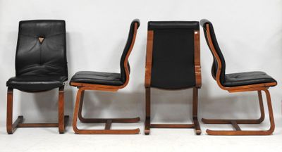 three black leather chairs sitting next to each other on a white surface