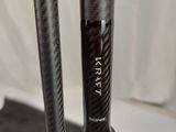 a close up of a bike handle with a stick on it