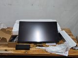 a laptop computer sitting on top of a wooden table