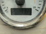 a close up of a speedometer on a table