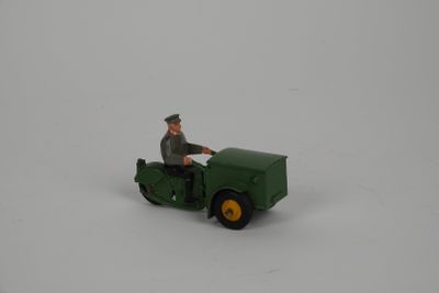a green toy truck with a man on it