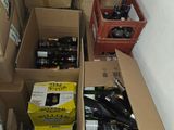 many boxes of wine and beer bottles sitting on the floor