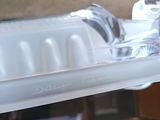 a close up of a toothbrush holder on a shelf
