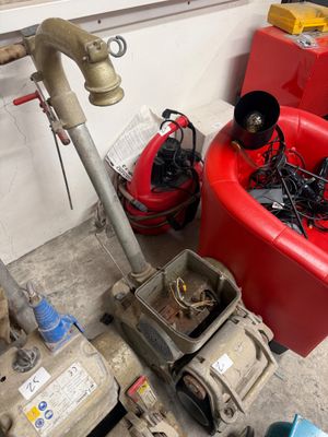 a fire hydrant that is sitting next to a red tub