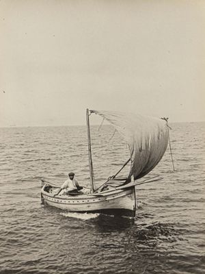 a black and white photo of a small boat in the water