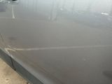 a close up of a car ' s door handle with a hole in it