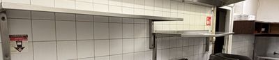 an image of a kitchen with a stove and a sink