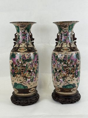 pair of antique chinese vases with hand painted flowers on them