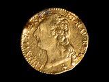une pièce d'or portant l'image d'un homme