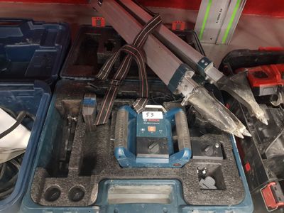 a blue tool box filled with tools and other items