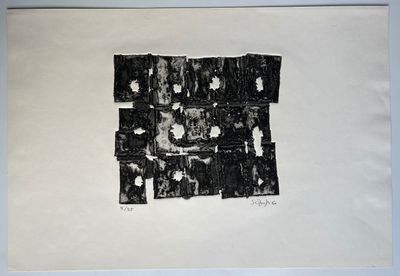 black and white photograph of a piece of paper with torn pieces on it
