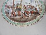 a plate with a picture of a group of people sitting at a table
