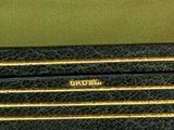 a close up of three pencils sitting on top of each other