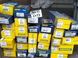 a pile of boxes that are stacked up on the ground