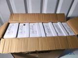 six boxes of electronic devices sitting on top of a cardboard box