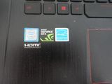 a close up of a laptop with a sticker on it