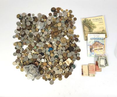a pile of coins and money sitting on a table